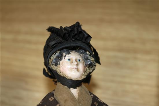 An Armand Marseille bisque headed doll, a peddler doll and sundry dolls house miniatures